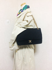 70's vintage Chanel classic black jersey 2.55 bag with double flap and skinny chain straps. One-of-a-kind bag. Ves