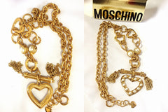 MINT. Vintage Moschino thick chain statement necklace with large heart charm with faux pearls and chain fringe. Jewelry By Moschino BIJOUX
