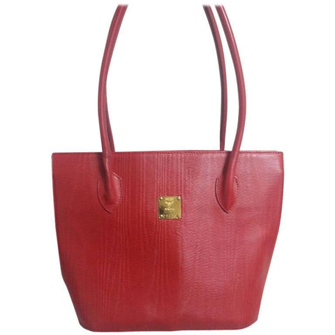 Vintage MCM red lizard embossed leather tote bag with monogram jacquard interior and golden square logo plate. Designed by Michael Cromer