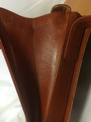 Vintage MCM brown monogram square shoulder bag with leather straps and golden star shape logo motif closure. Designed by Michael Cromer.