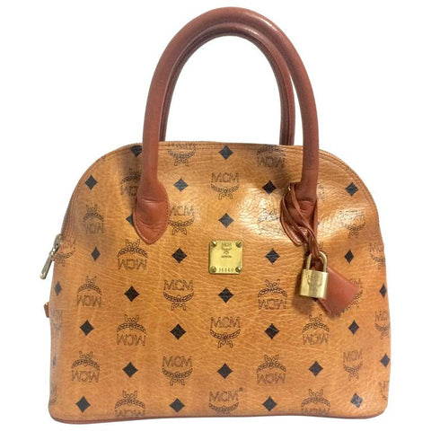 Vintage MCM classic brown monogram handbag in bolide design. Classic bag designed by Michael Cromer. Handmade in Germany