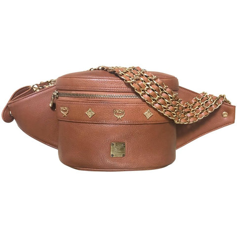 Vintage MCM brown leather fanny pack with multiple layer golden chain and leather belt with logo studded motifs. Rare masterpiece.