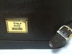 Vintage MOSCHINO genuine dark brown leather backpack with golden and black M logo motif from cheap and chic by moschino. Perfect daily bag