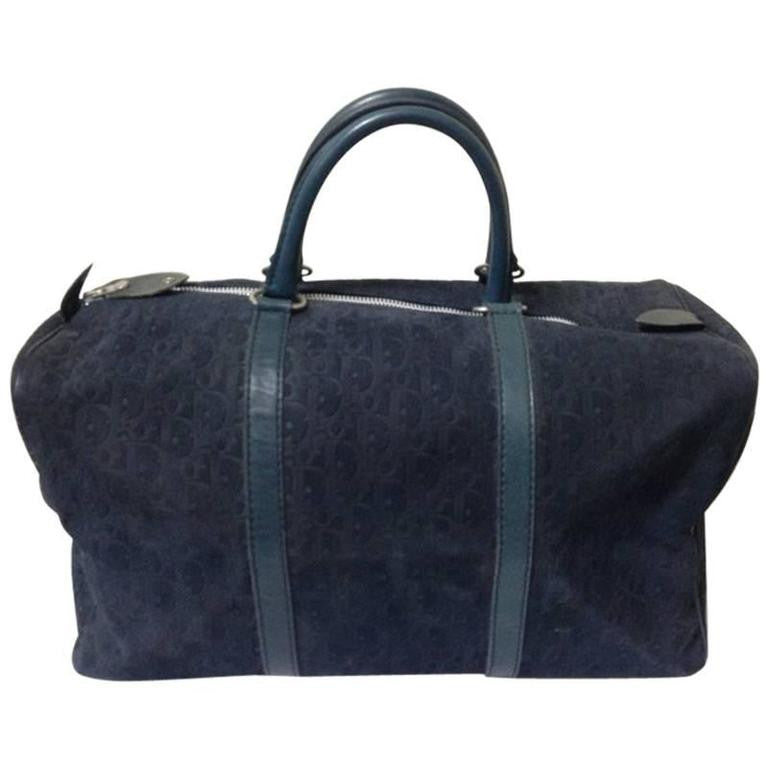 80's vintage Christian Dior Bagages navy genuine suede leather travel duffle bag, purse, handbag with embossed Dior logo allover. Unisex