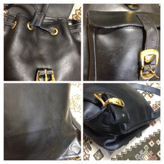 Vintage Gianni Versace black leather backpack with a big embossed medusa with gold tone hardware. Unisex bag for daily use.