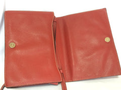 Vintage Valentino Garavani red pigskin shoulder clutch bag with unique logo stitch mark.