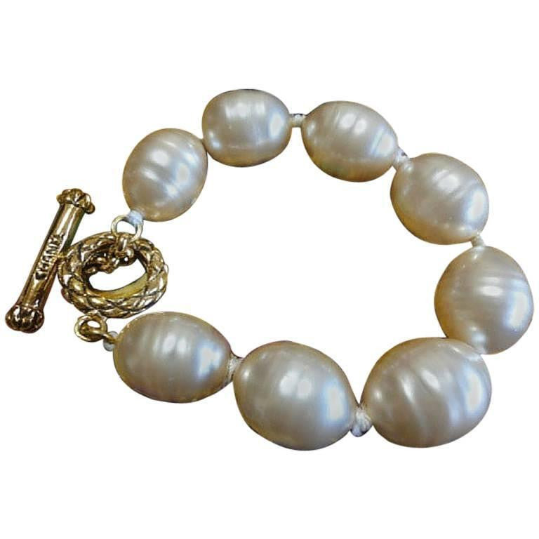 Vintage CHANEL extra large faux baroque pearl bracelet with logo